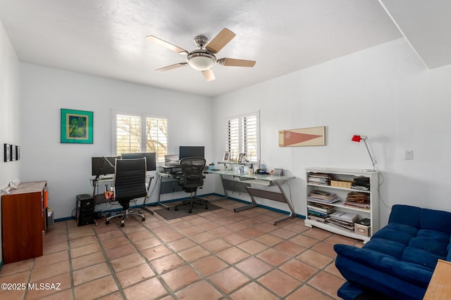office area with ceiling fan and light tile patterned floors