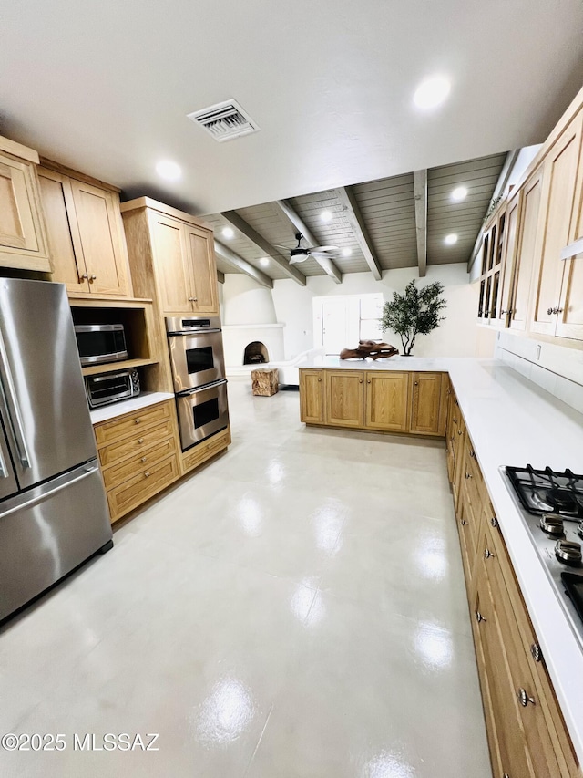 4250 E Aquarius Dr, Tucson, AZ 85718 - kitchen with stainless steel appliances, concrete flooring, beam ceiling, recessed lighting, and light countertops