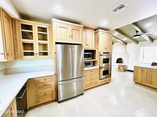 4250 E Aquarius Dr, Tucson, AZ 85718 - kitchen featuring appliances with stainless steel finishes, light countertops, glass insert cabinets, a ceiling fan, and beam ceiling