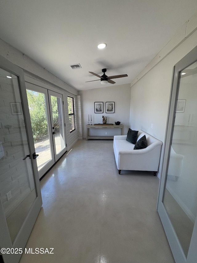 4250 E Aquarius Dr, Tucson, AZ 85718 - living room with finished concrete flooring, a ceiling fan, and recessed lighting