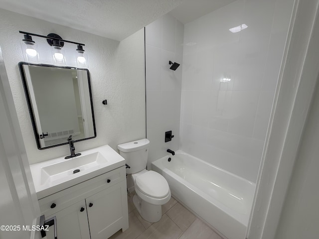 bathroom featuring a textured ceiling, vanity, tile patterned flooring, toilet, and a textured wall