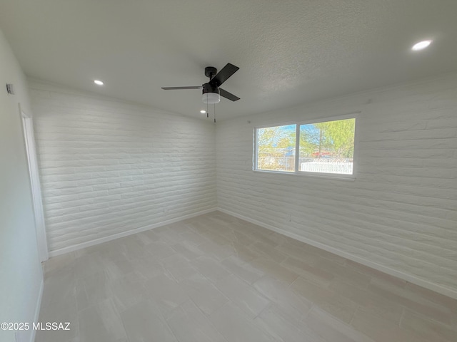 empty room with a textured ceiling, ceiling fan, recessed lighting, and light floors