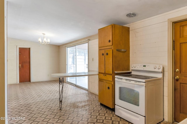 kitchen featuring a notable chandelier, brown cabinets, and electric range