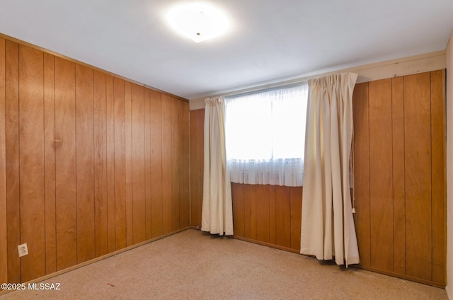 empty room with wood walls