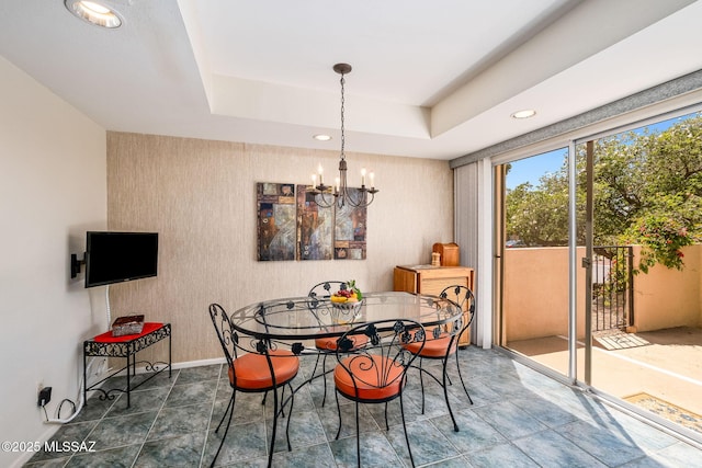 dining room with an inviting chandelier, baseboards, and recessed lighting