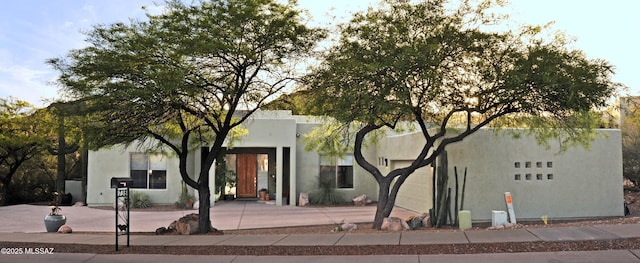 738 S Tohono Ridge Pl, Tucson, AZ 85745 - view of building exterior featuring a garage and driveway