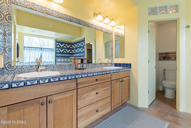 738 S Tohono Ridge Pl, Tucson, AZ 85745 - full bathroom featuring double vanity, toilet, and finished concrete flooring