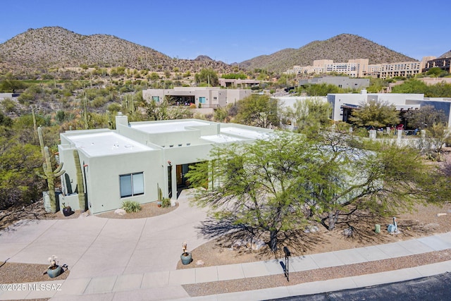 738 S Tohono Ridge Pl, Tucson, AZ 85745 - view of front of house featuring a mountain view, a chimney, and stucco siding