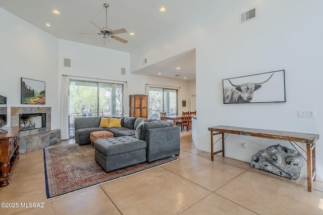 738 S Tohono Ridge Pl, Tucson, AZ 85745 - living area featuring a towering ceiling, a ceiling fan, recessed lighting, and a fireplace