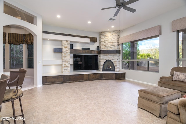 37717 S Terrace Park Dr, Saddlebrooke, AZ 85739 - tiled living room with a fireplace, a ceiling fan, baseboards, and recessed lighting