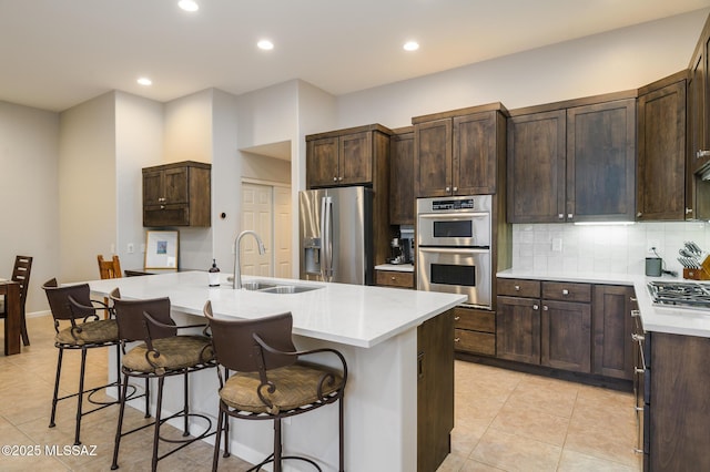 37717 S Terrace Park Dr, Saddlebrooke, AZ 85739 - kitchen with stainless steel appliances, a sink, light tile patterned floors, light countertops, and recessed lighting