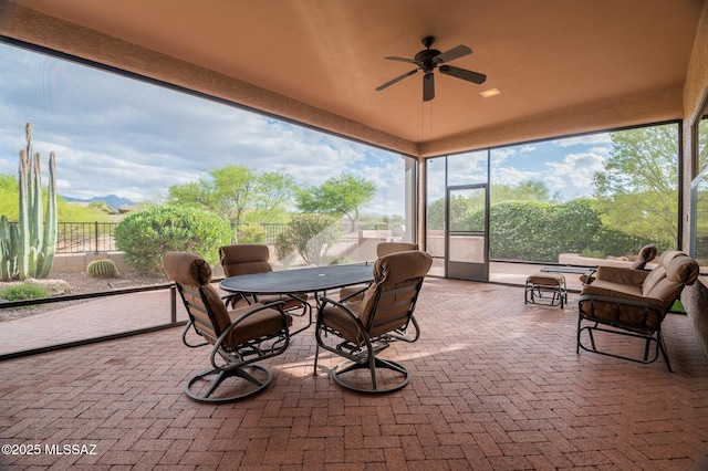 37717 S Terrace Park Dr, Saddlebrooke, AZ 85739 - sunroom / solarium featuring ceiling fan, brick flooring, and outdoor dining space