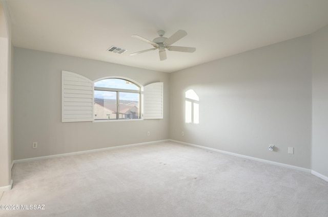 37717 S Terrace Park Dr, Saddlebrooke, AZ 85739 - empty room featuring plenty of natural light, a ceiling fan, and light carpet