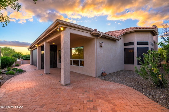 37717 S Terrace Park Dr, Saddlebrooke, AZ 85739 - rear view of property with a patio area, stucco siding, and a tile roof