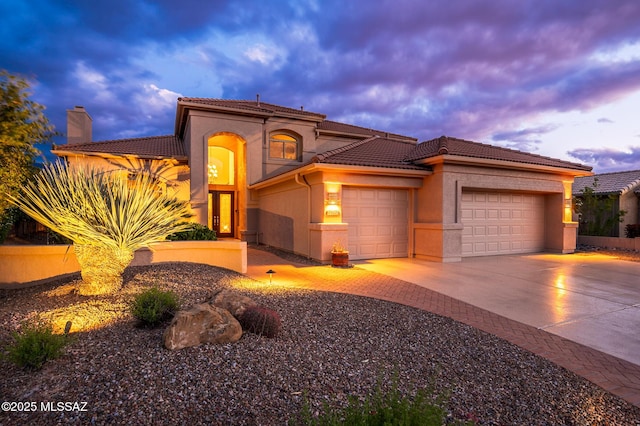 37717 S Terrace Park Dr, Saddlebrooke, AZ 85739 - mediterranean / spanish-style home featuring a garage, driveway, a tiled roof, stucco siding, and a chimney