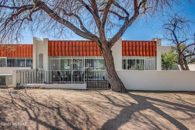 view of gate with fence