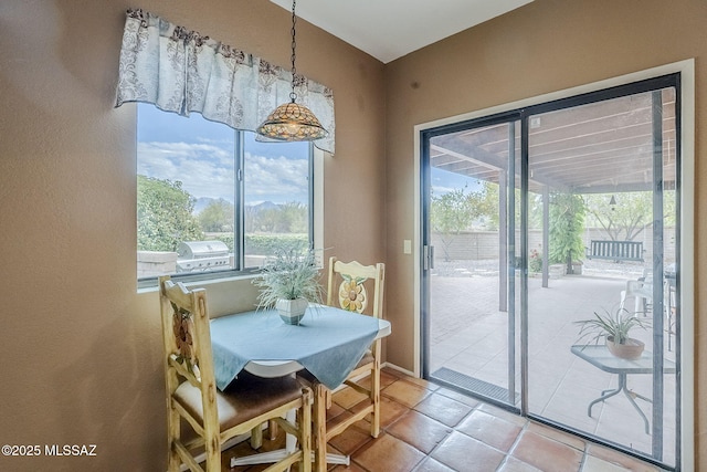 dining space with light tile patterned floors