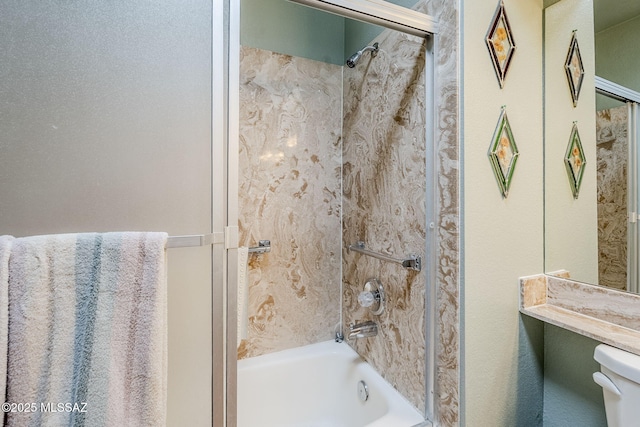 full bathroom with washtub / shower combination and toilet