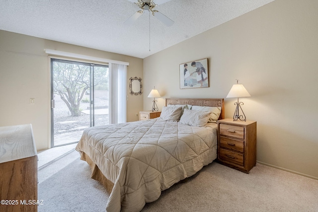 carpeted bedroom with access to outside, ceiling fan, baseboards, and a textured ceiling