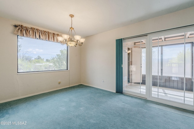 carpeted spare room featuring baseboards and a notable chandelier