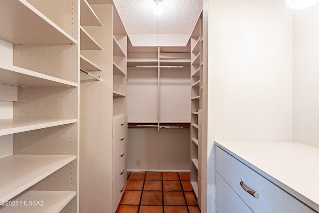 4401 E Havasu Rd, Tucson, AZ 85718 - bathroom featuring a textured ceiling, a bath, visible vents, tile walls, and a tile shower