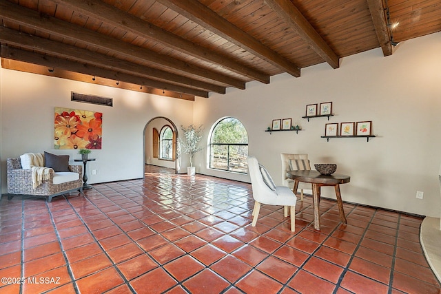 4401 E Havasu Rd, Tucson, AZ 85718 - unfurnished room featuring arched walkways, tile patterned flooring, wood ceiling, and beam ceiling