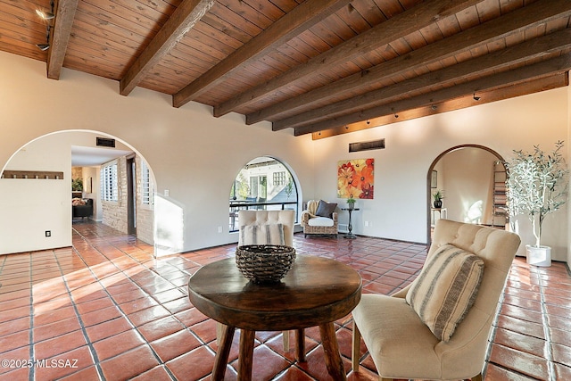 4401 E Havasu Rd, Tucson, AZ 85718 - tiled living room with arched walkways, beamed ceiling, and wood ceiling