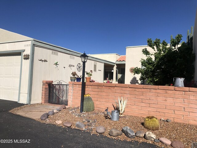 adobe home with stucco siding and a mountain view