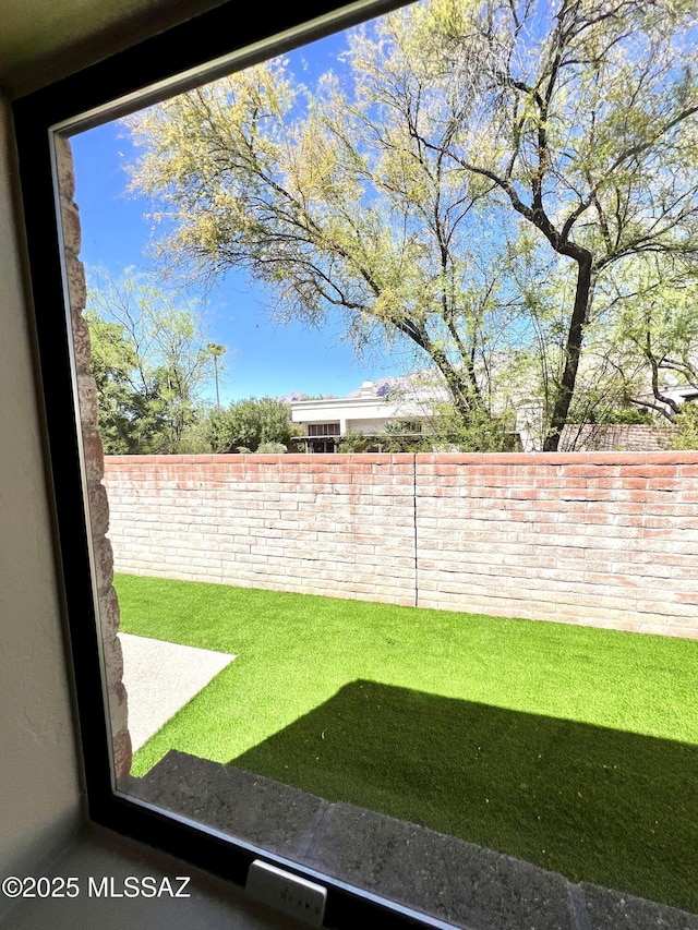 view of yard with a fenced backyard