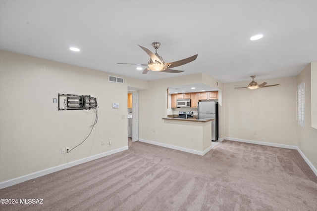 unfurnished living room with baseboards, light carpet, recessed lighting, a ceiling fan, and visible vents