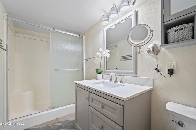 full bath with a shower stall and a textured wall