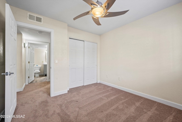 unfurnished bedroom featuring visible vents, baseboards, a closet, ceiling fan, and carpet floors