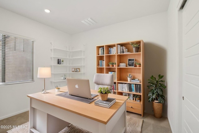 office space featuring baseboards, recessed lighting, and light colored carpet