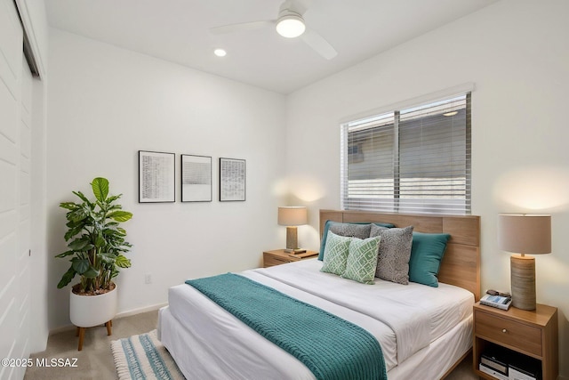carpeted bedroom featuring baseboards, a ceiling fan, and recessed lighting