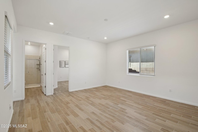 unfurnished bedroom featuring light wood-style floors, baseboards, and recessed lighting