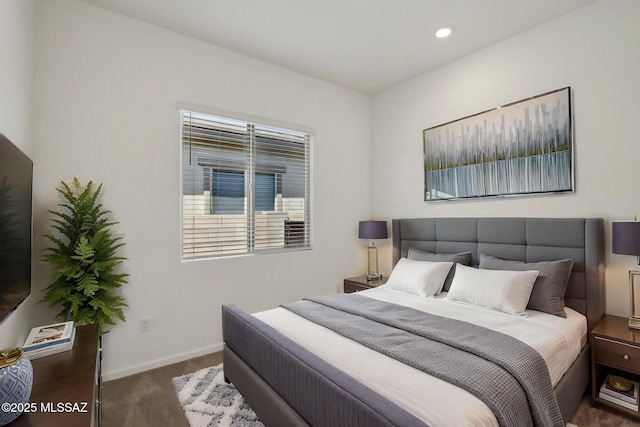 carpeted bedroom featuring baseboards and recessed lighting