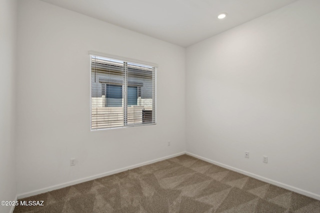 spare room featuring baseboards, carpet, and recessed lighting