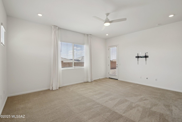 carpeted empty room with recessed lighting, baseboards, and ceiling fan
