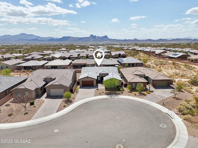 drone / aerial view featuring a residential view and a mountain view