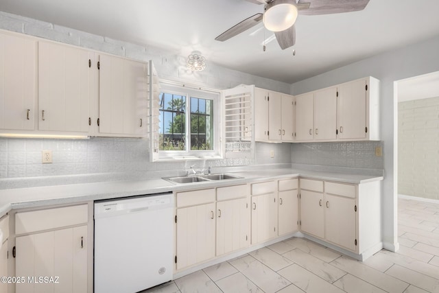 kitchen featuring a sink, tasteful backsplash, white dishwasher, ceiling fan, and light countertops