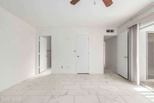 unfurnished bedroom with visible vents, marble finish floor, a ceiling fan, and access to outside