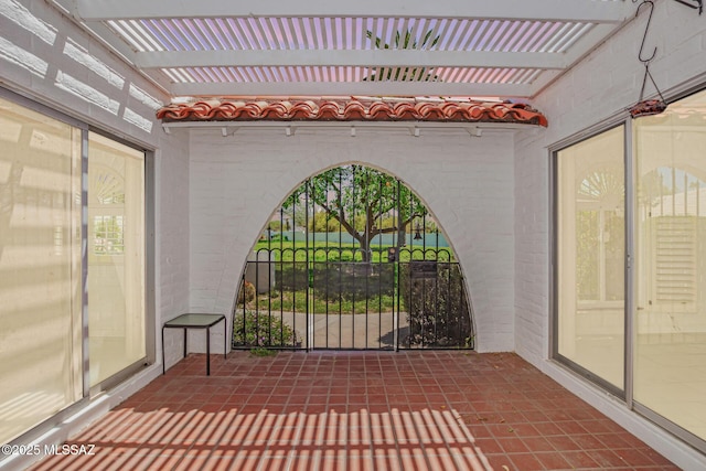 unfurnished sunroom featuring a wealth of natural light