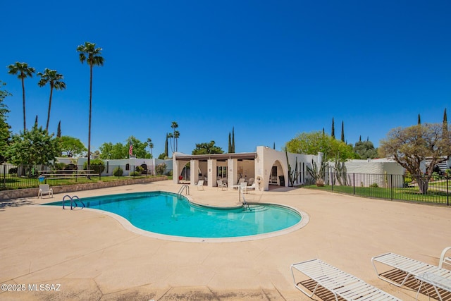 pool featuring a patio and fence private yard
