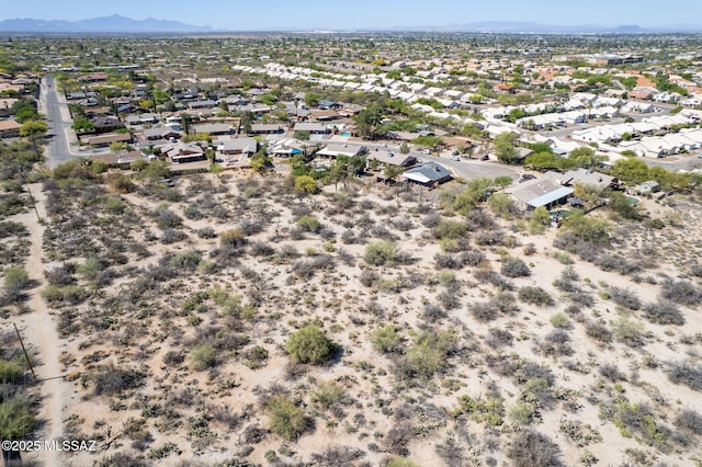 drone / aerial view featuring a residential view and a mountain view