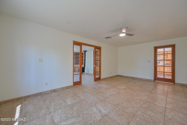 1402 N Camino Miraflores, Tucson, AZ 85745 - empty room with french doors, a ceiling fan, baseboards, and light tile patterned floors