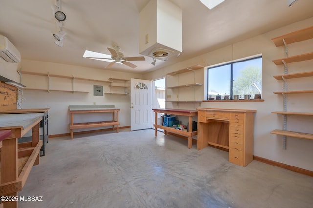 1402 N Camino Miraflores, Tucson, AZ 85745 - below grade area with a workshop area, a wall unit AC, baseboards, and a ceiling fan