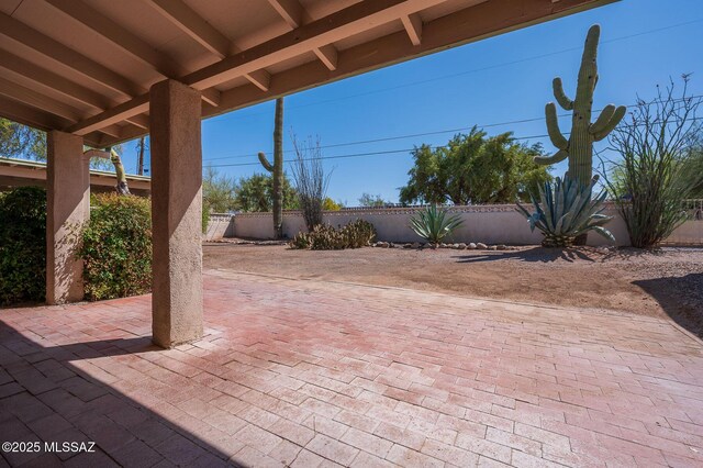 1402 N Camino Miraflores, Tucson, AZ 85745 - fenced backyard featuring a patio