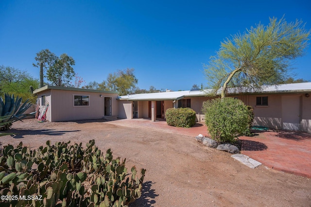 1402 N Camino Miraflores, Tucson, AZ 85745 - view of front of home featuring a patio