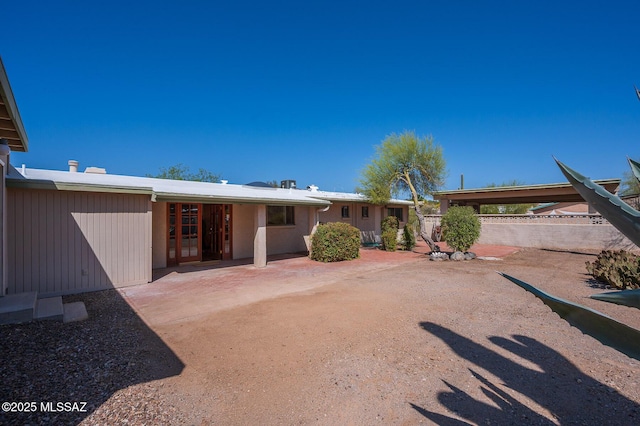 1402 N Camino Miraflores, Tucson, AZ 85745 - back of property featuring a patio area