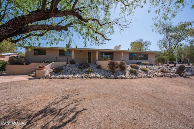 1402 N Camino Miraflores, Tucson, AZ 85745 - single story home with a chimney and stucco siding
